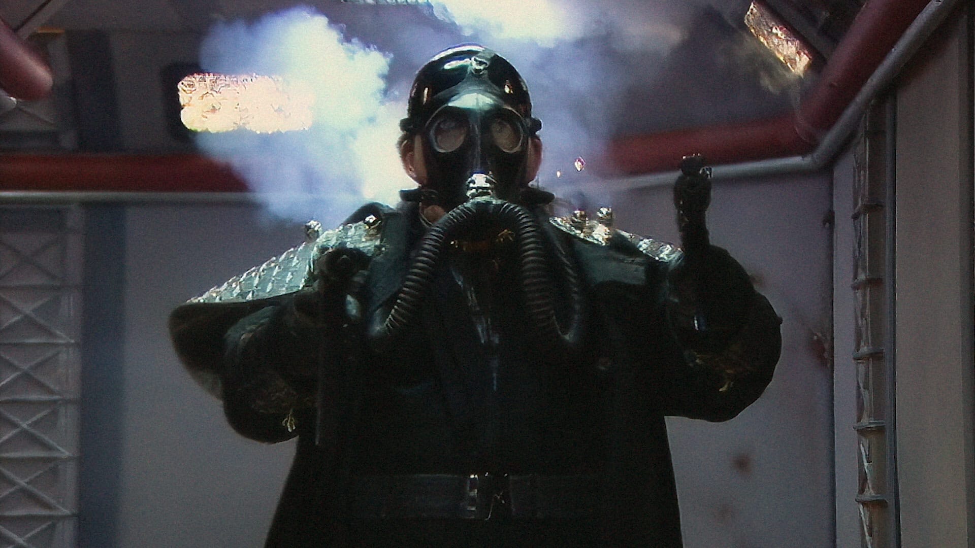A man in a gas mask starring in a Groovie Ghoulies Music Video.