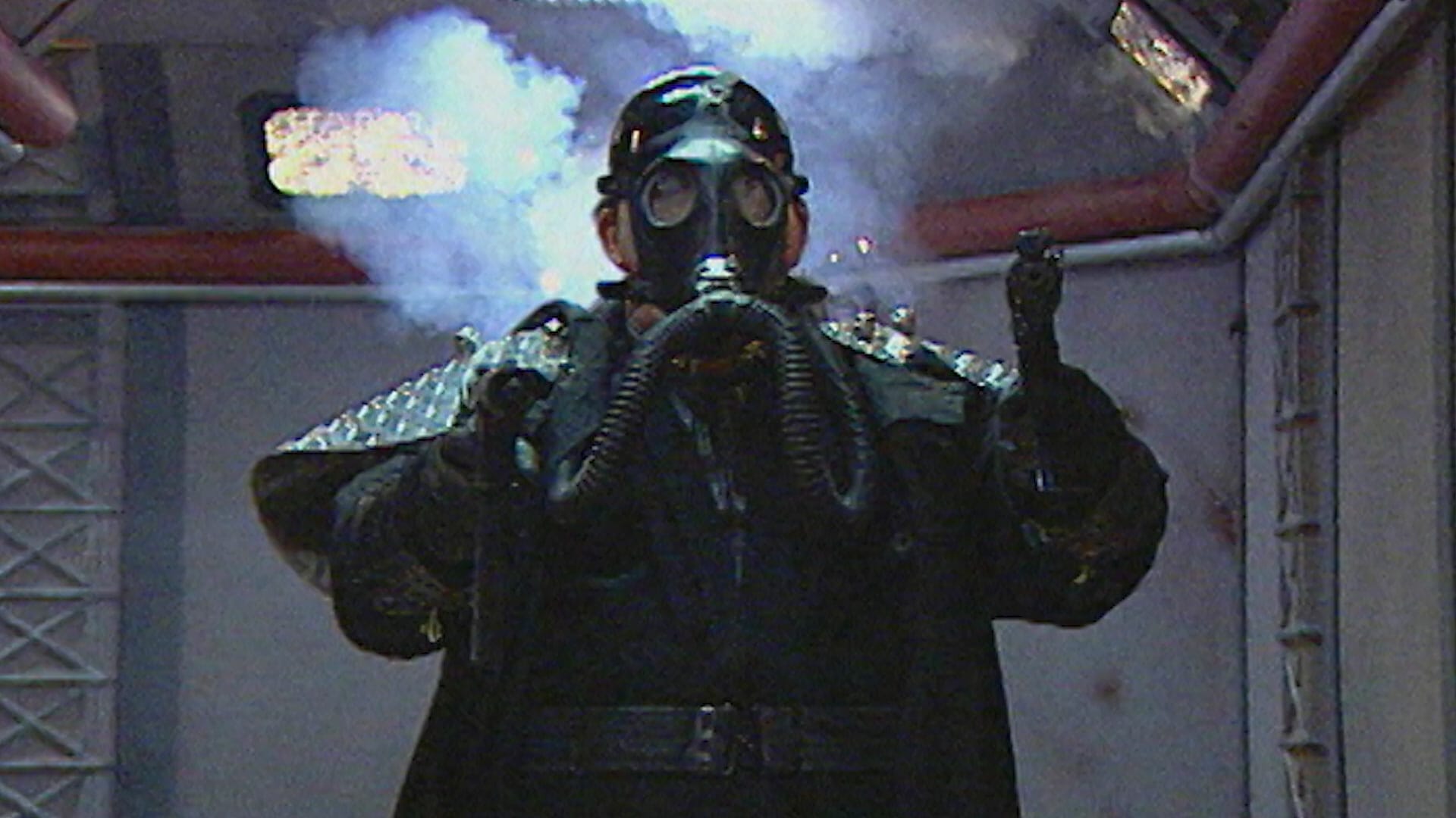 A man in a gas mask appearing in the Groovie Ghoulies Music Video for "Til Death Do Us Party.