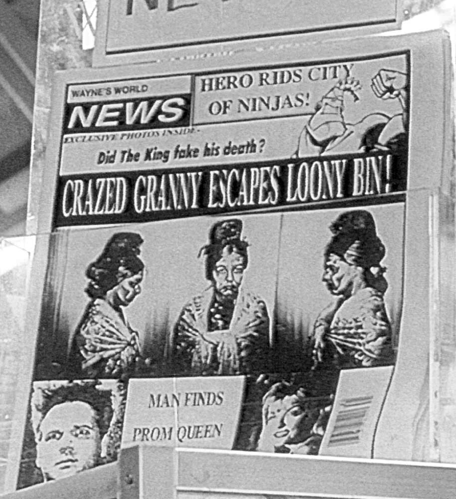 Black and white image featuring a tabloid
