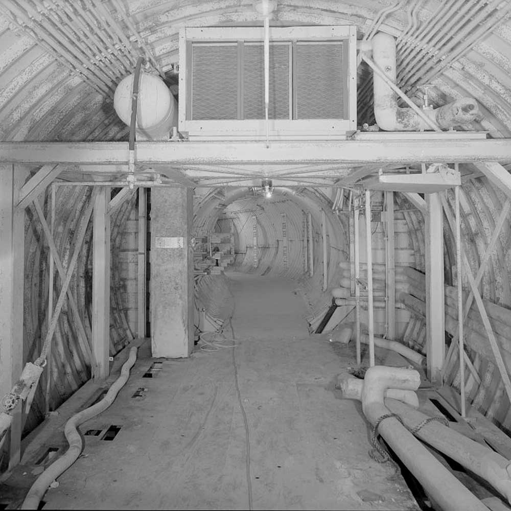 A black and white photo of a tunnel.