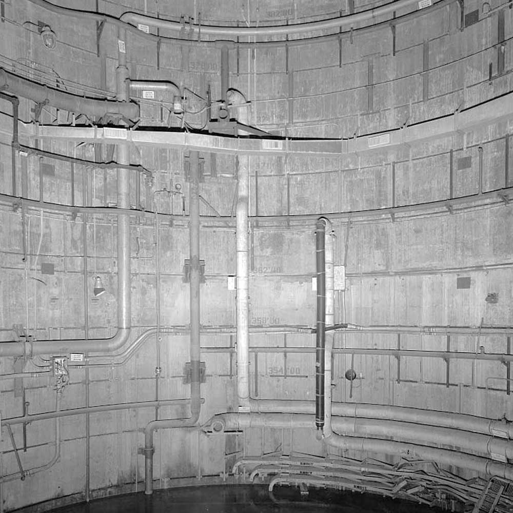 A black and white photo of a large concrete structure.