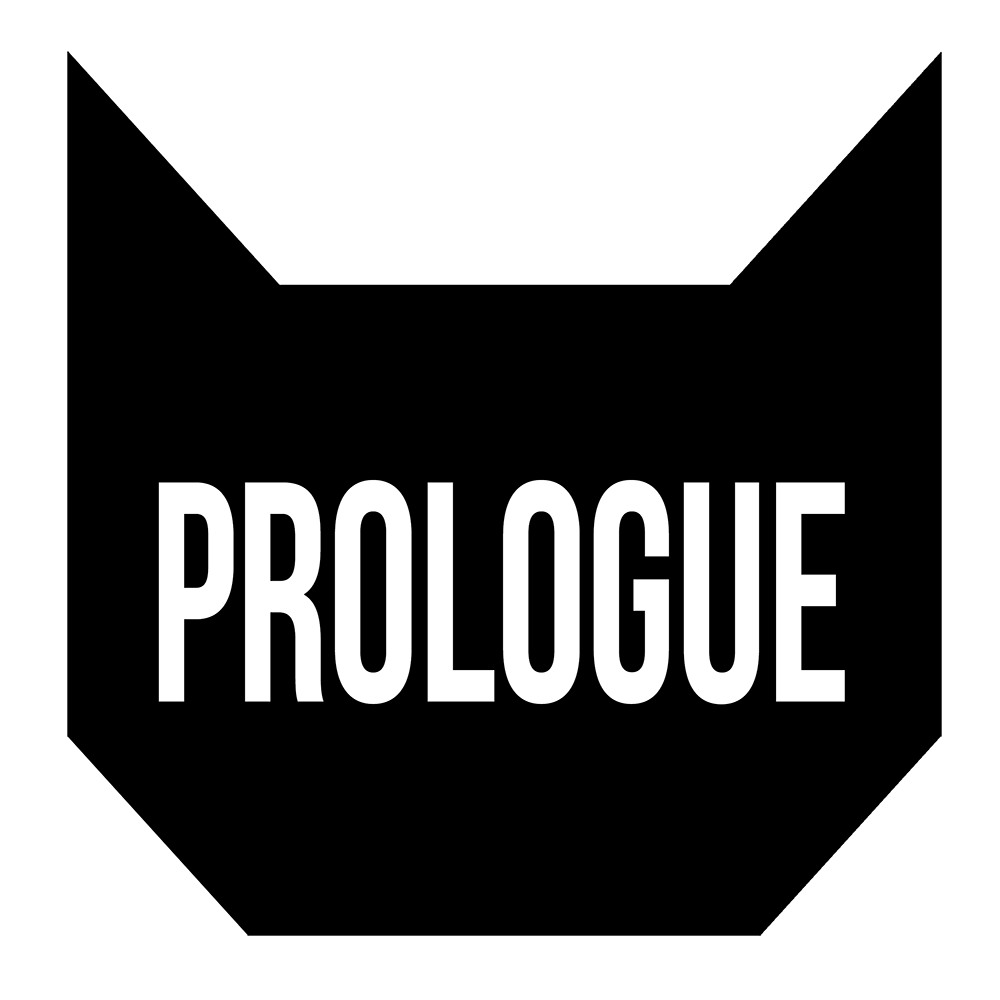 A black geometric shape resembling a cat's head with the word "PROLOGUE" in bold white capital letters in the center.